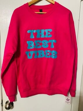 Hot Pink Crewneck Sweatshirt with Turquoise Graphic